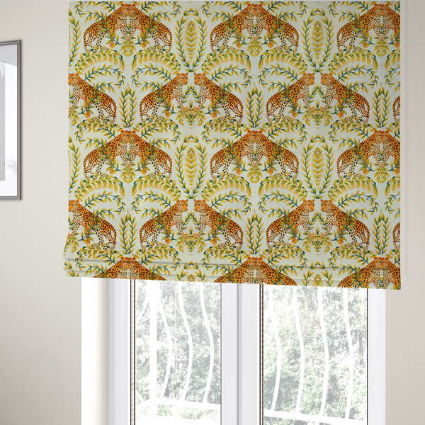 The fabric used to create these Roman blinds is a symmetrical design of spotted leopards surrounded by golden and green tropical foliage and palm leaves.