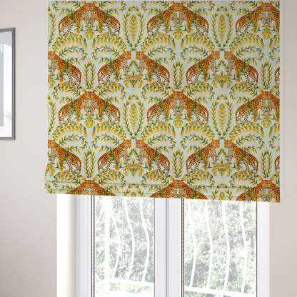 The fabric used to create these Roman blinds is a symmetrical design of spotted leopards surrounded by golden and green tropical foliage and palm leaves.