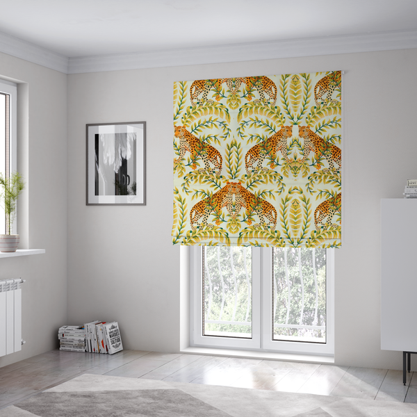 The fabric used to create these Roman blinds is a symmetrical design of spotted leopards surrounded by golden and green tropical foliage and palm leaves.