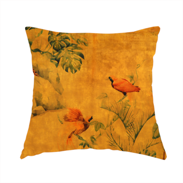 The fabric used to create this handmade cushion is a warm orange and gold background with jungle wildlife, including leopards, tropical birds, large green leaves, and rocky terrain.