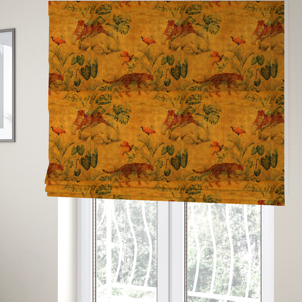 The fabric used to create these Roman blinds is a warm orange and gold background with jungle wildlife, including leopards, tropical birds, large green leaves, and rocky terrain.