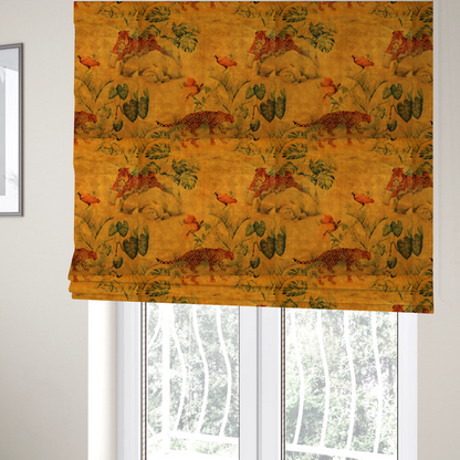 The fabric used to create these Roman blinds is a warm orange and gold background with jungle wildlife, including leopards, tropical birds, large green leaves, and rocky terrain.