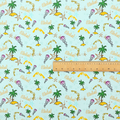 Tropical-themed pattern fabric with palm trees, jellyfish, and 'Aloha!' text on a light blue background.