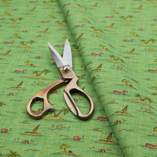 Green fabric with a repeating beach pattern featuring islands, palm trees, and beach balls.