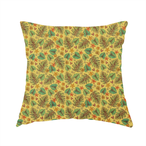 The fabric used to create this handmade cushion is a dense, repeating tropical print on a yellow background featuring green palm fronds, heart-shaped leaves, orange starfish, and tiny sea shells.