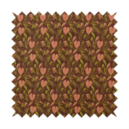 A brown upholstery fabric featuring a repeating pattern of pink heart-shaped leaves, green foliage, and delicate botanical details.