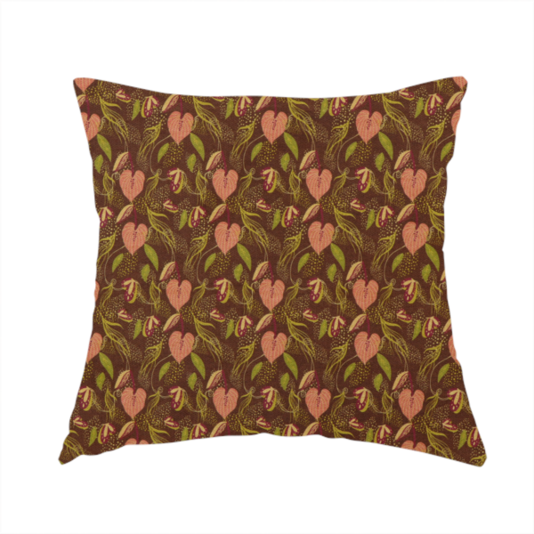 The fabric used to create this handmade cushion is a brown upholstery fabric featuring a repeating pattern of pink heart-shaped leaves, green foliage, and delicate botanical details.