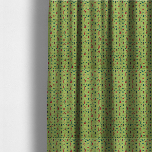 The fabric used to create these made-to-measure curtains is a green upholstery fabric featuring a ditsy folk-art pattern of small red berries, sprigs, and dark blue leaves.