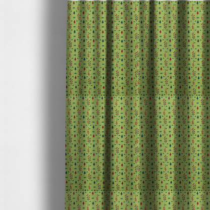 The fabric used to create these made-to-measure curtains is a green upholstery fabric featuring a ditsy folk-art pattern of small red berries, sprigs, and dark blue leaves.