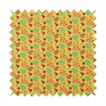A yellow upholstery fabric featuring a vibrant tropical pattern of red, green, and brown leaves and flowers.