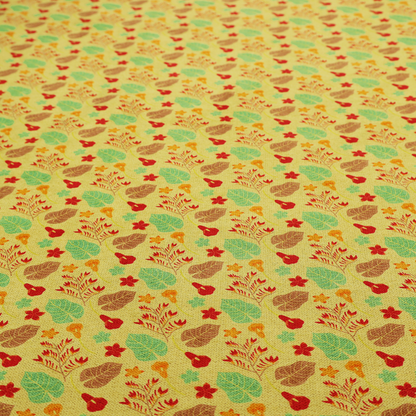 A yellow upholstery fabric featuring a vibrant tropical pattern of red, green, and brown leaves and flowers.