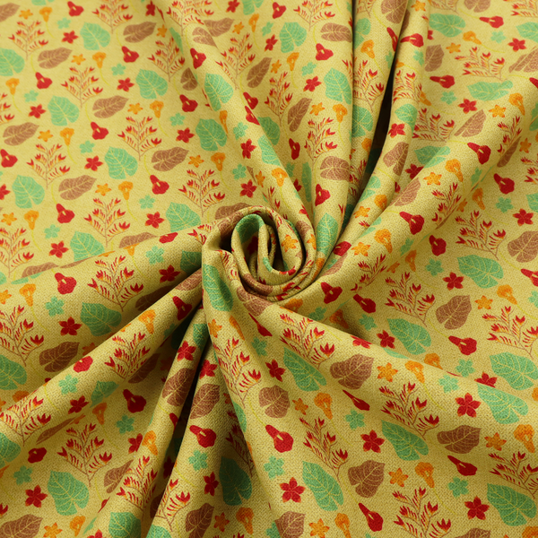 A yellow upholstery fabric featuring a vibrant tropical pattern of red, green, and brown leaves and flowers.