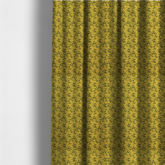 The fabric used to create these made-to-measure curtains is a mustard yellow fabric featuring a dense, repeating pattern of small dark green or black trailing vines with tiny leaves and a subtle woven texture.