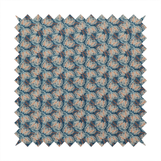 A dark blue and slate textured fabric featuring a dense, repeating mosaic pattern of small tropical leaves in shades of cream and rust orange.
