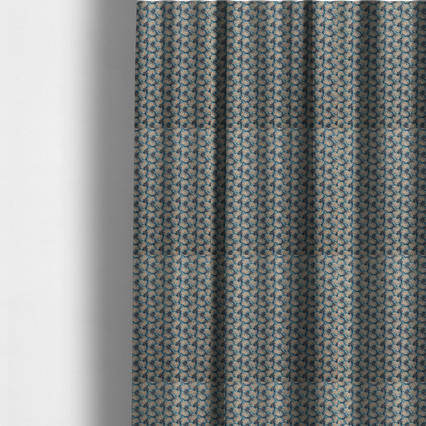 The fabric used to create these made-to-measure curtains is a dark blue and slate textured fabric featuring a dense, repeating mosaic pattern of small tropical leaves in shades of cream and rust orange.