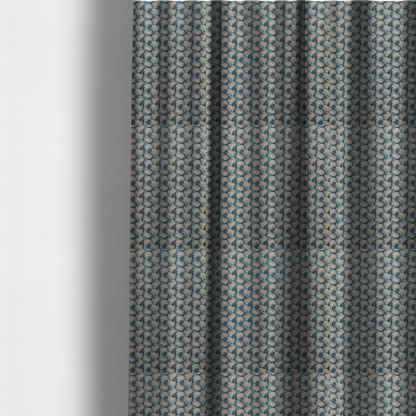 The fabric used to create these made-to-measure curtains is a dark blue and slate textured fabric featuring a dense, repeating mosaic pattern of small tropical leaves in shades of cream and rust orange.