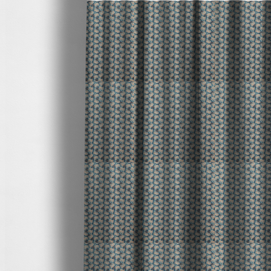 The fabric used to create these made-to-measure curtains is a dark blue and slate textured fabric featuring a dense, repeating mosaic pattern of small tropical leaves in shades of cream and rust orange.