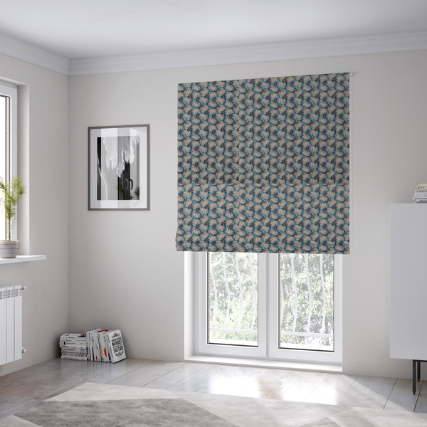 The fabric used to create these Roman blinds is a dark blue and slate textured fabric featuring a dense, repeating mosaic pattern of small tropical leaves in shades of cream and rust orange.