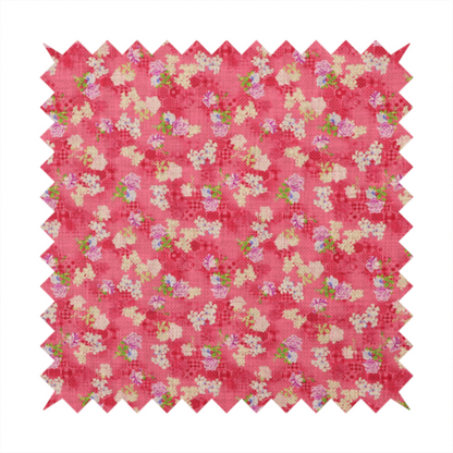 A vibrant raspberry pink fabric featuring a dense, repeating pattern of small white, purple, and green floral clusters over a subtle checked texture.