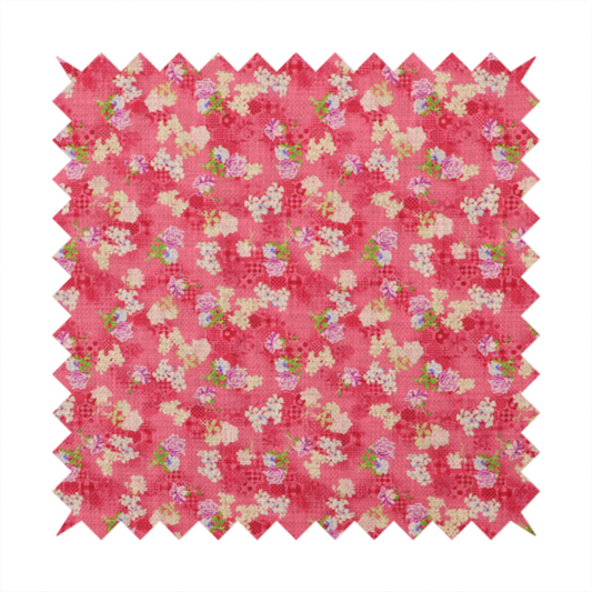 A vibrant raspberry pink fabric featuring a dense, repeating pattern of small white, purple, and green floral clusters over a subtle checked texture.