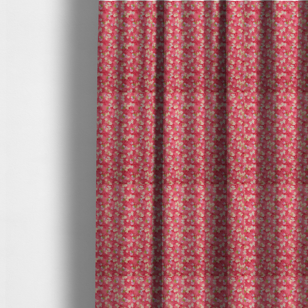 The fabric used to create these made-to-measure curtains is a vibrant raspberry pink fabric featuring a dense, repeating pattern of small white, purple, and green floral clusters over a subtle checked texture.