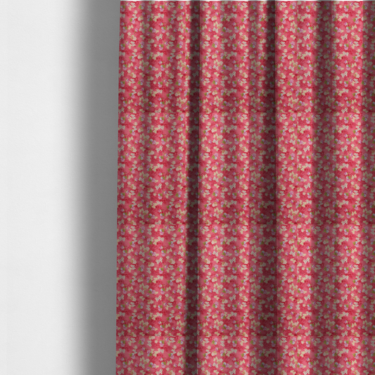 The fabric used to create these made-to-measure curtains is a vibrant raspberry pink fabric featuring a dense, repeating pattern of small white, purple, and green floral clusters over a subtle checked texture.