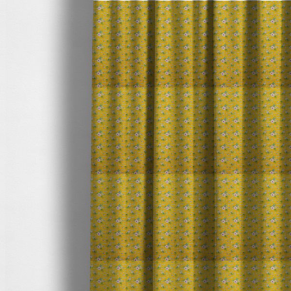 The fabric used to create these made-to-measure curtains is a textured mustard yellow fabric featuring a repeating micro floral pattern of small white and pink blossoms with green leaves and blue accents.