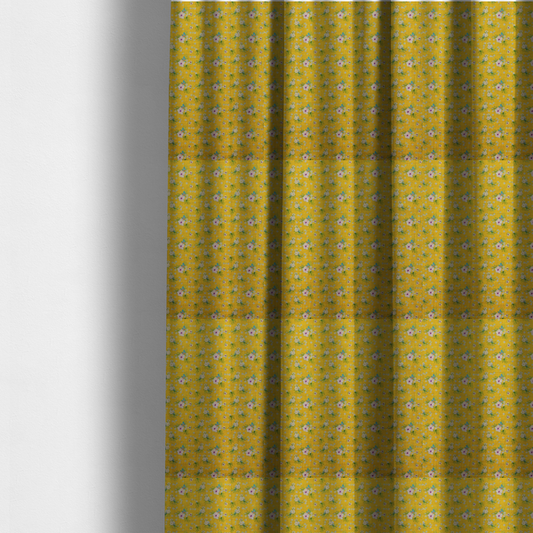 The fabric used to create these made-to-measure curtains is a textured mustard yellow fabric featuring a repeating micro floral pattern of small white and pink blossoms with green leaves and blue accents.