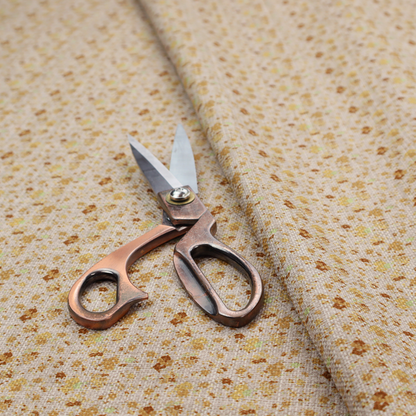 Textured light beige or cream fabric featuring a dense repeating pattern of tiny gold, yellow, and brown micro flowers.
