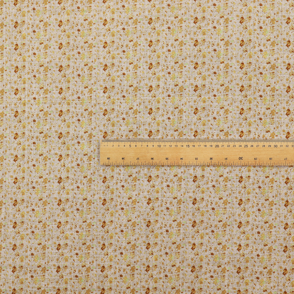 Textured light beige or cream fabric featuring a dense repeating pattern of tiny gold, yellow, and brown micro flowers.