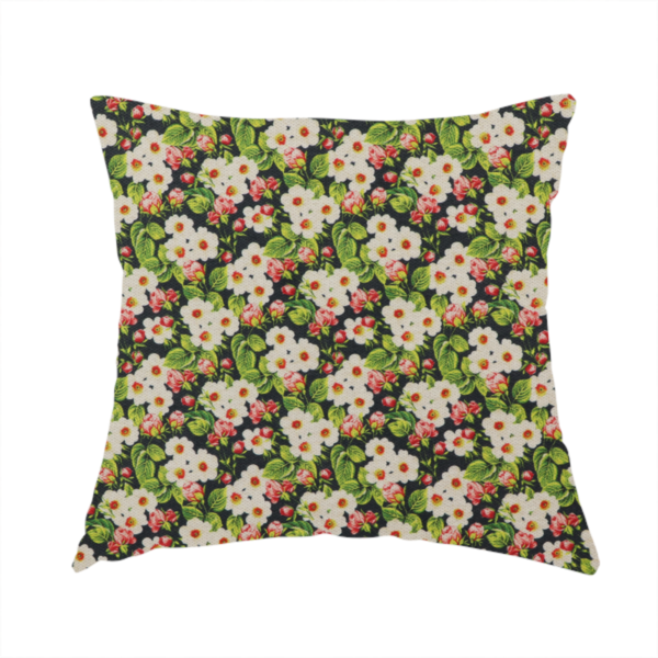 The fabric used to create this handmade cushion is a dense vintage-style micro-floral print fabric featuring tiny white blossoms, pink buds, and green leaves set against a dark background.
