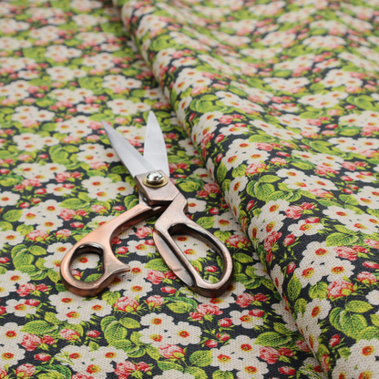 A dense vintage-style micro-floral print fabric featuring tiny white blossoms, pink buds, and green leaves set against a dark background.