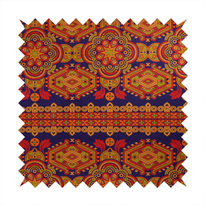 A deep purple textile adorned with intricate, ornate patterns including large mandala medallions, geometric motifs, and a central horizontal decorative stripe in shades of red, orange, and olive green.