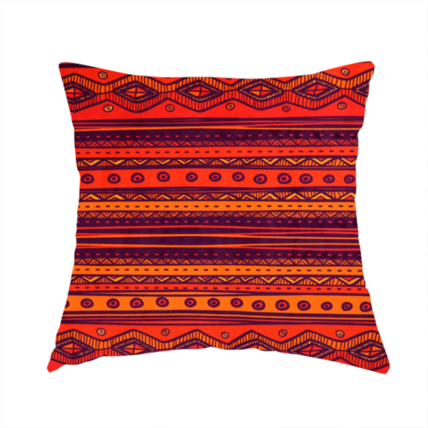 The fabric used to create this handmade cushion is a vibrant orange and red fabric featuring a repeating tribal geometric and striped pattern.