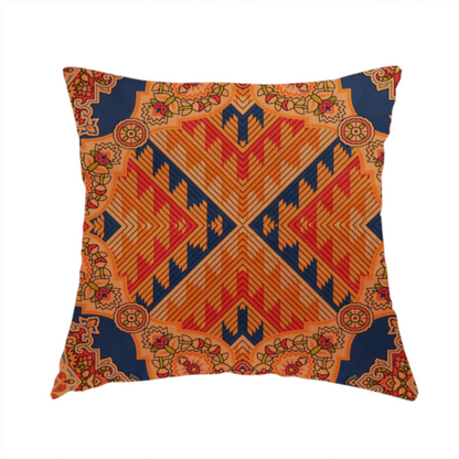 The fabric used to create this handmade cushion is a large, diamond-shaped geometric centrepiece filled with fine diagonal lines and stair-step tribal or Aztec-inspired patterns in orange and dark blue.