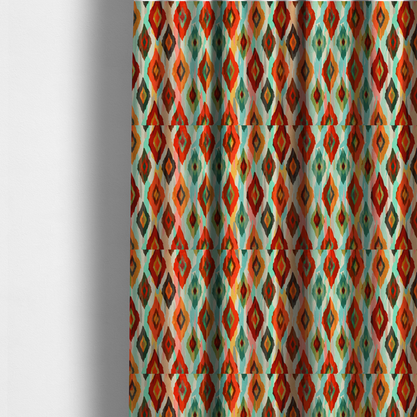 The fabric used to create these made-to-measure curtains is a staggered rows of watercolour-effect, multi-layered diamonds that create a dynamic, textured, and boho-chic visual flow.