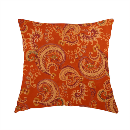 The fabric used to create this handmade cushion is an elaborate, repeating paisley and baroque scroll design filled with swirling vines, teardrop shapes, and floral flourishes.