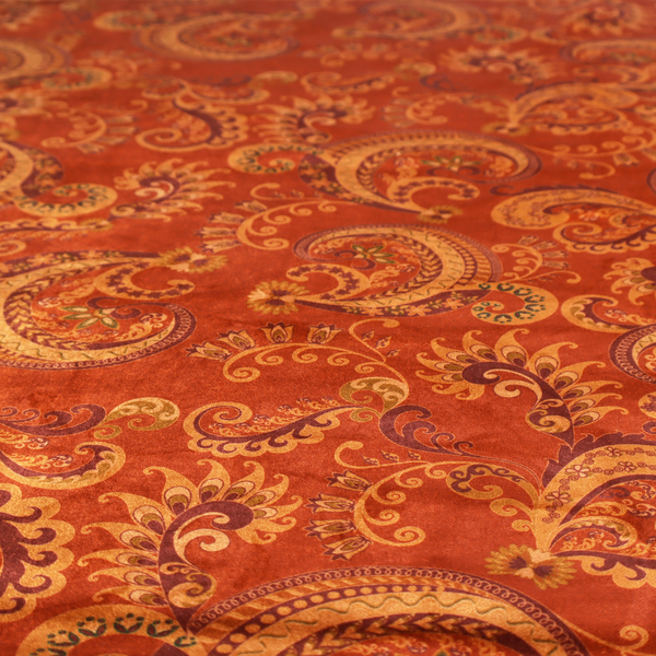 An elaborate, repeating paisley and baroque scroll design filled with swirling vines, teardrop shapes, and floral flourishes.
