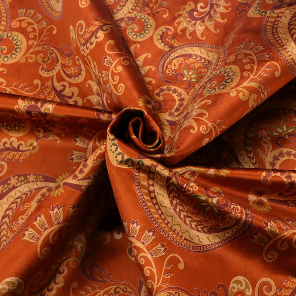 An elaborate, repeating paisley and baroque scroll design filled with swirling vines, teardrop shapes, and floral flourishes.