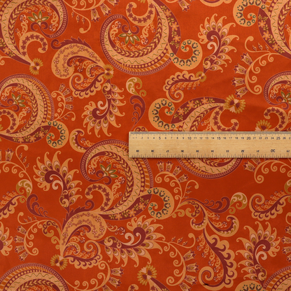 An elaborate, repeating paisley and baroque scroll design filled with swirling vines, teardrop shapes, and floral flourishes.