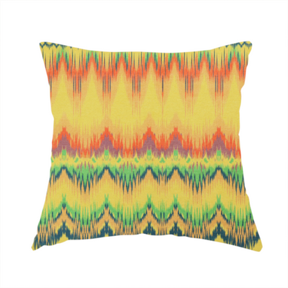 The fabric used to create this handmade cushion has horizontal bands of intricate, jagged zig-zags, flame-like vertical gradations, and a central diamond-patterned border stripe that mimic traditional ikat weaving.
