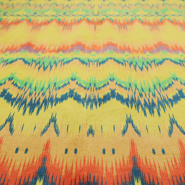 Horizontal bands of intricate, jagged zig-zags, flame-like vertical gradations, and a central diamond-patterned border stripe that mimic traditional ikat weaving.