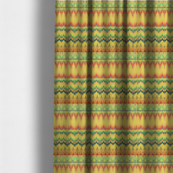 The fabric used to create these made-to-measure curtains has horizontal bands of intricate, jagged zig-zags, flame-like vertical gradations, and a central diamond-patterned border stripe that mimic traditional ikat weaving.
