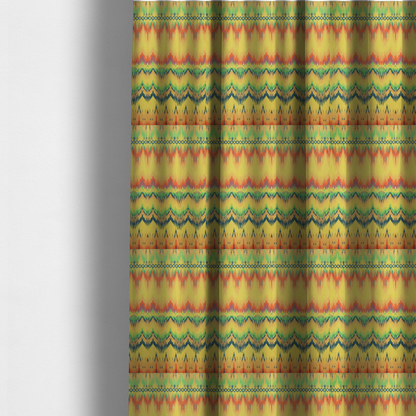 The fabric used to create these made-to-measure curtains has horizontal bands of intricate, jagged zig-zags, flame-like vertical gradations, and a central diamond-patterned border stripe that mimic traditional ikat weaving.