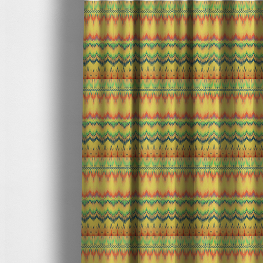 The fabric used to create these made-to-measure curtains has horizontal bands of intricate, jagged zig-zags, flame-like vertical gradations, and a central diamond-patterned border stripe that mimic traditional ikat weaving.