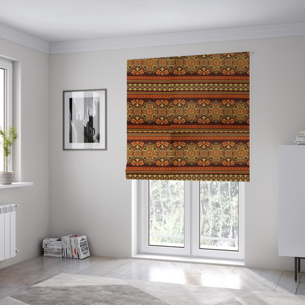 The fabric used to create these Roman blinds is an alternating horizontal rows featuring large, intricate damask or medallion roundels, smaller floral scrollwork, and geometric border stripes.