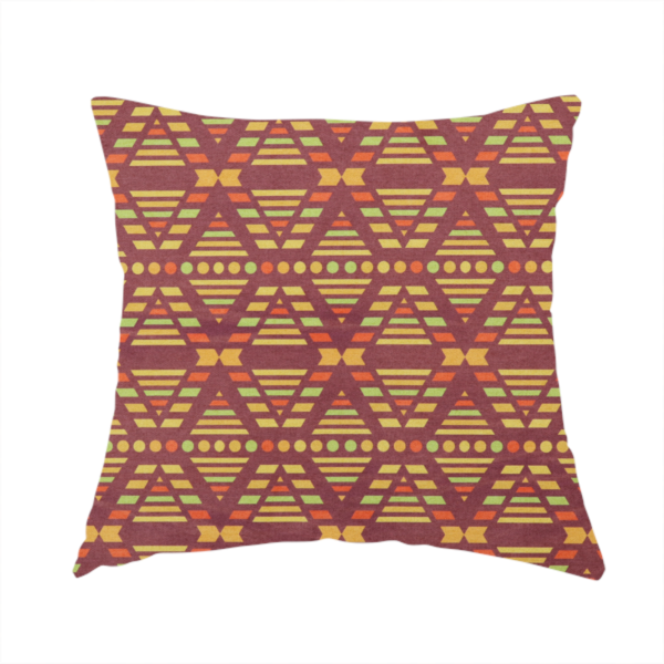 The fabric used to create this handmade cushion is a structured, geometric textile pattern with an Aztec-inspired aesthetic and repeated diamond motifs.