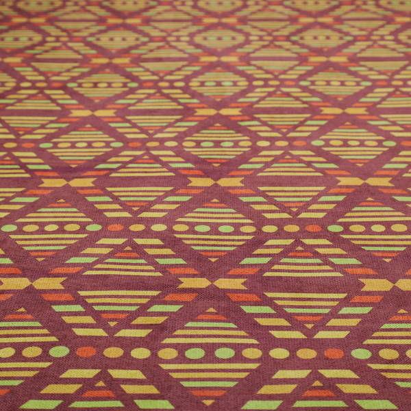 The image features a structured, geometric textile pattern with an Aztec-inspired aesthetic and repeated diamond motifs.