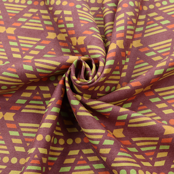 The image features a structured, geometric textile pattern with an Aztec-inspired aesthetic and repeated diamond motifs.