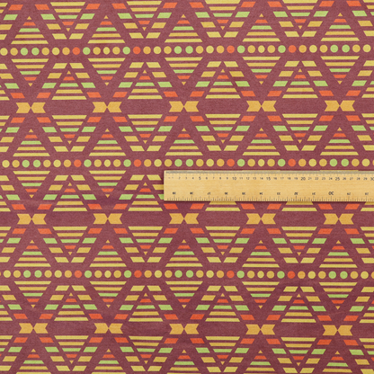 The image features a structured, geometric textile pattern with an Aztec-inspired aesthetic and repeated diamond motifs.